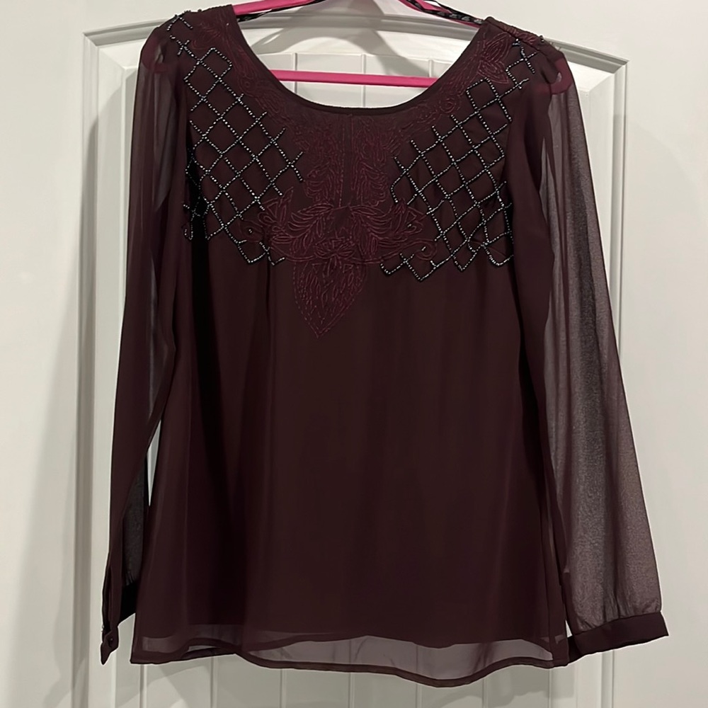 BKE boutique deep wine top. Sheer long sleeves. Size small. Bead detailing.
